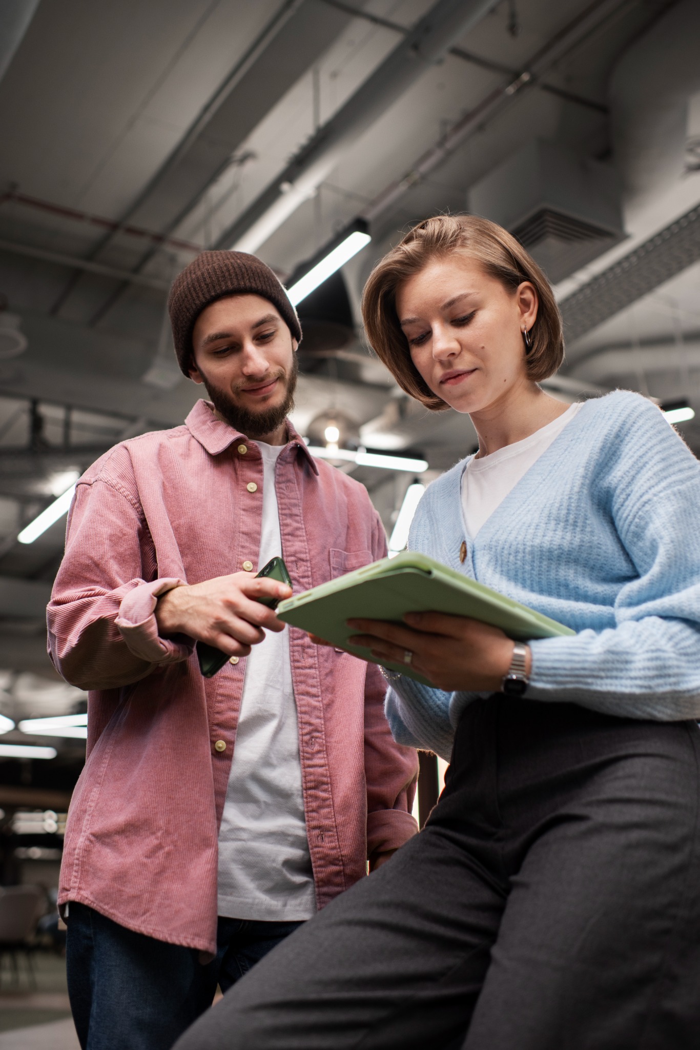 Two people reviewing a project together