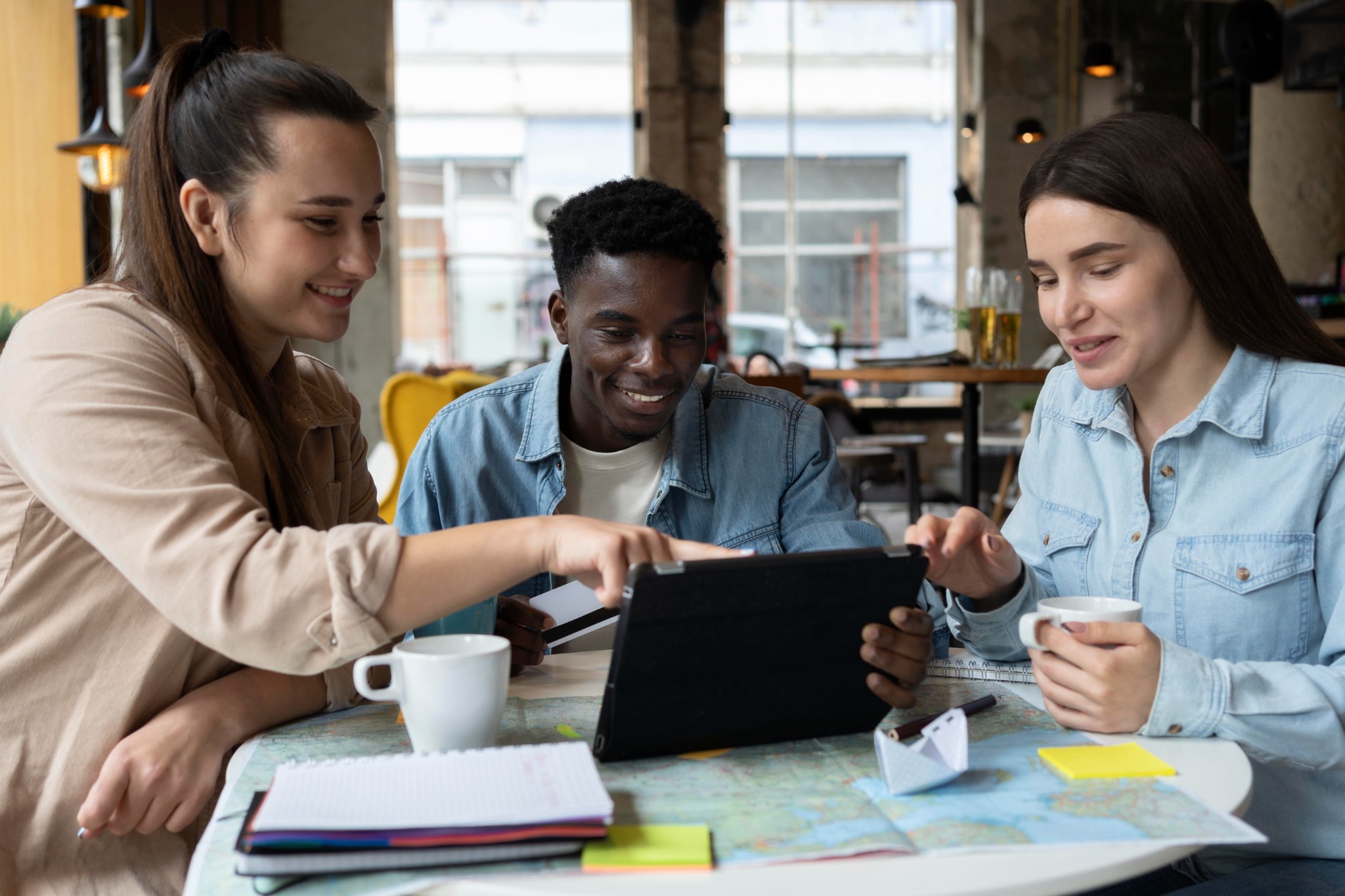 Young adults planning together using a tablet